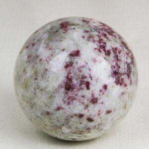 Highly polished and perfectly round sphere made from Cherry blossom stone (Cinnabrite) with 57 mm diameter