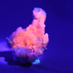 Manganocalcite crystal cluster under UV-light