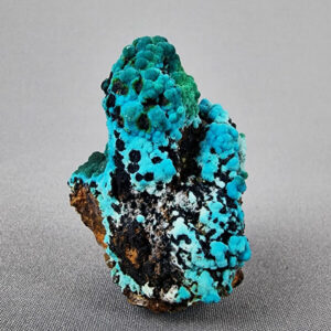 Quartz point with chrysocolla crystals